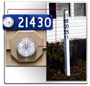 911 locator beacons shown in locations on house number, side paneling of a home, and on a signpost that shows the house number. 